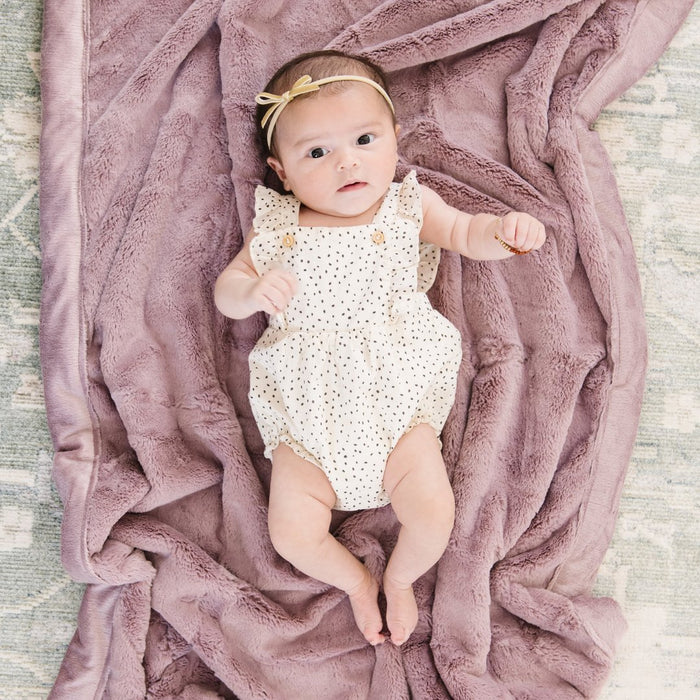 Baby laying on Saranoni Receiving Lush Blanket - Bloom