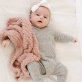 Baby laying with Saranoni Receiving Ribbed Bamboni Blanket - Cameo
