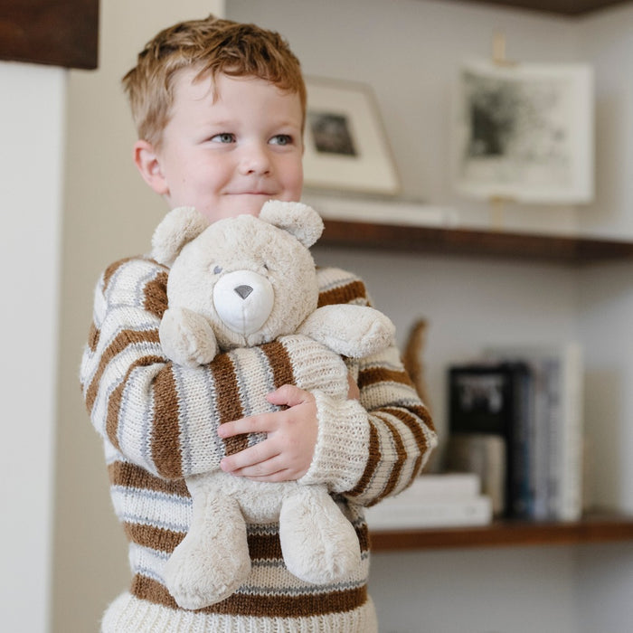 Child hugs Saranoni Stuffed Animal - Bear