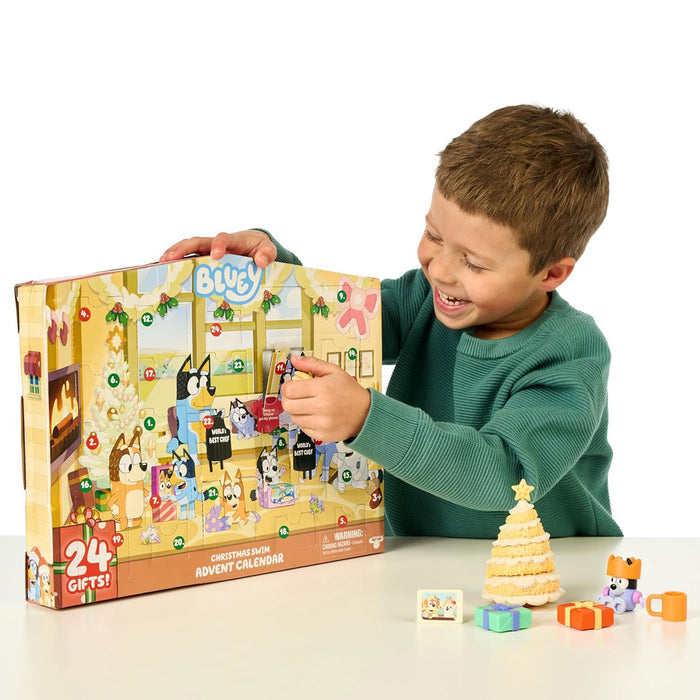 Boy opens door of Moose Toys Bluey Advent Calendar - Christmas Swim