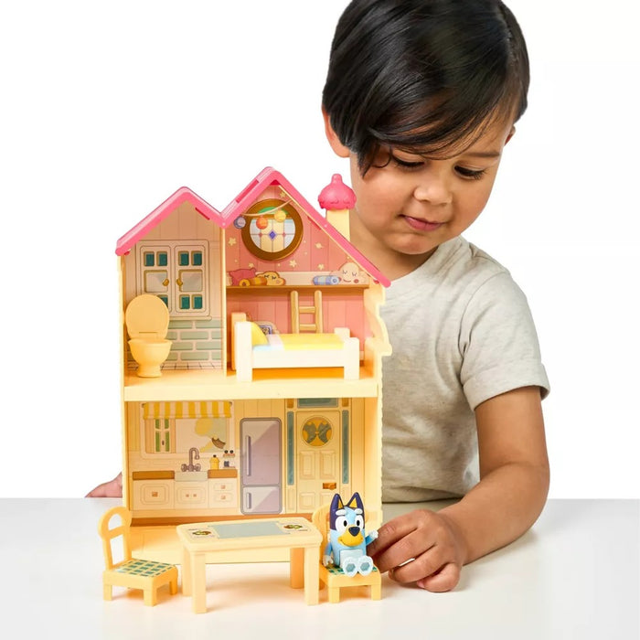 Child playing with Moose Toys Bluey Mini Home Playset