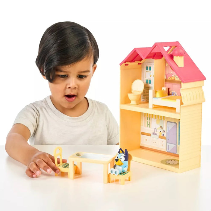 Child playing with Moose Toys Bluey Mini Home Playset