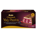 Box of Ülker Chocolate Yas Pasta with a slice of cake on a white background. Ulker Milk Chocolate Cake with Velvety Red Velvet Base and Forest Berry Sauce – 13.9 oz (395 G)