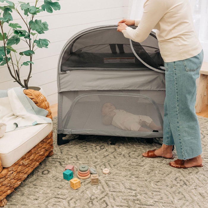 Mom unzips UPPAbaby REMI Playard Canopy