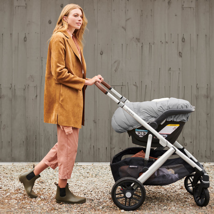 Woman pushing stroller with UPPAbaby CozyGanoosh - MESA / ARIA - STELLA (Grey Brushed Melange)