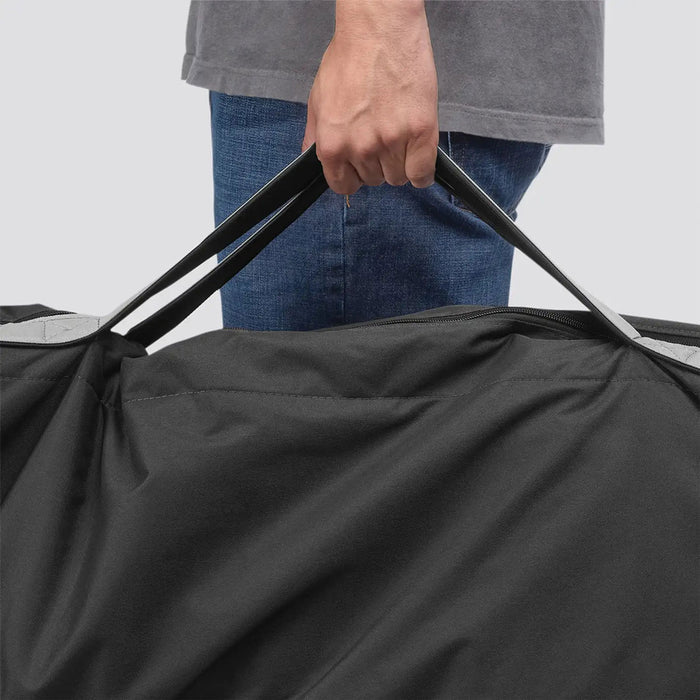 Man carrying stroller in UPPAbaby G-LUXE / G-LITE TravelSafe Travel Bag