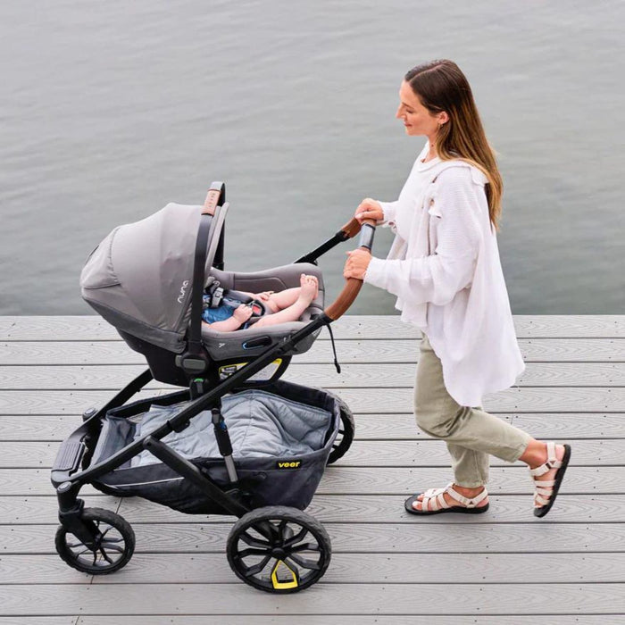 Woman pushes stroller with Veer Switchback &Roll Frame or &Jog Frame Leather Grips