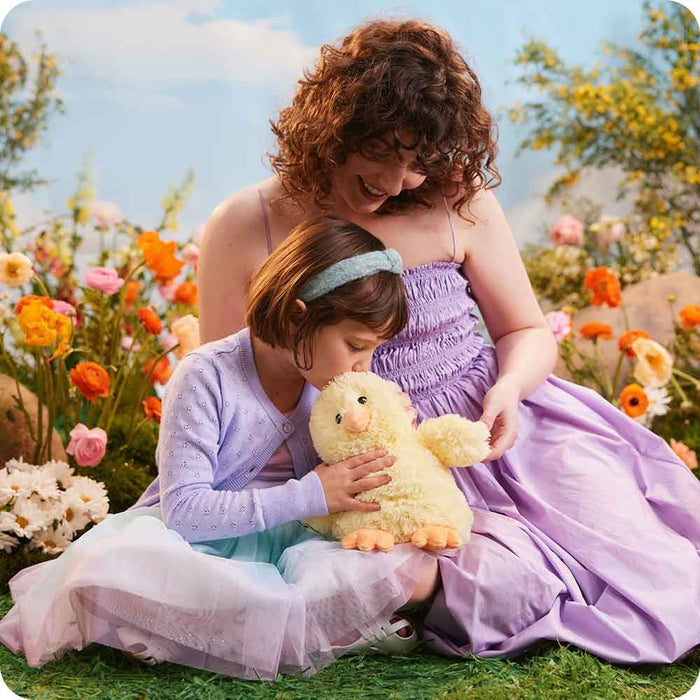 Little girl kisses Warmies Chick