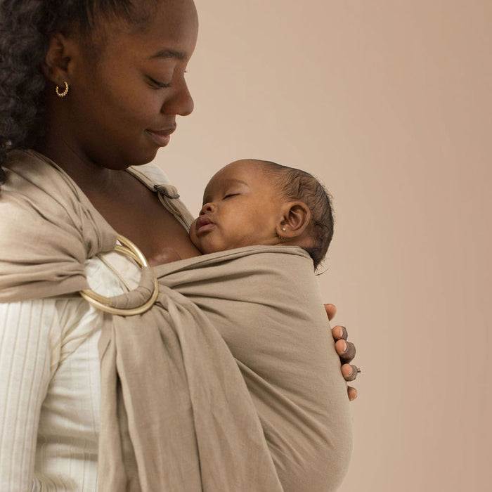 Mom wearing baby in WildBird Linen Sling - Desert Lark